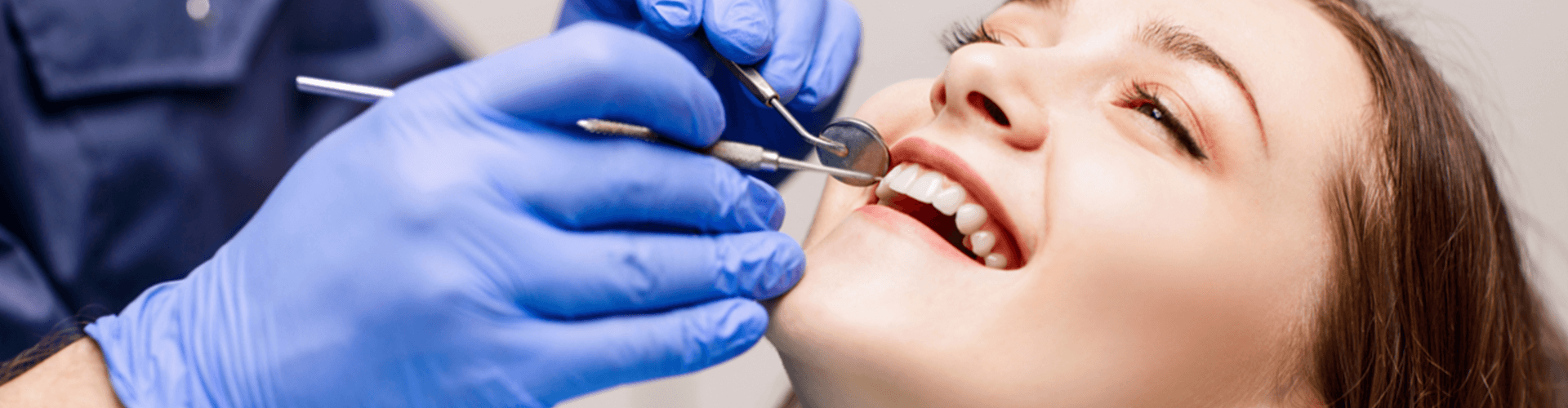 female having her teeth cleaned